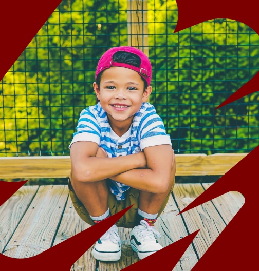 small child sitting on ground