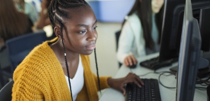 student at school on computer