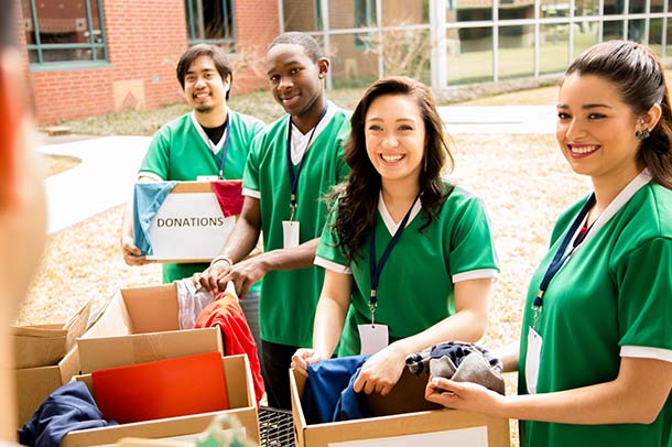 volunteers with school supplies