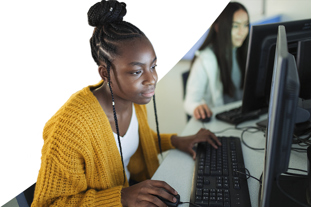 High school student typing on a computer keyboard