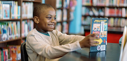 Student reading in library