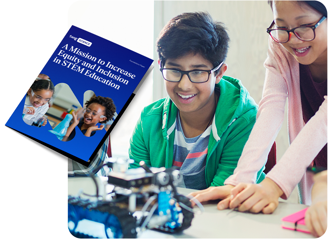 Two students working with simple robots in a classroom