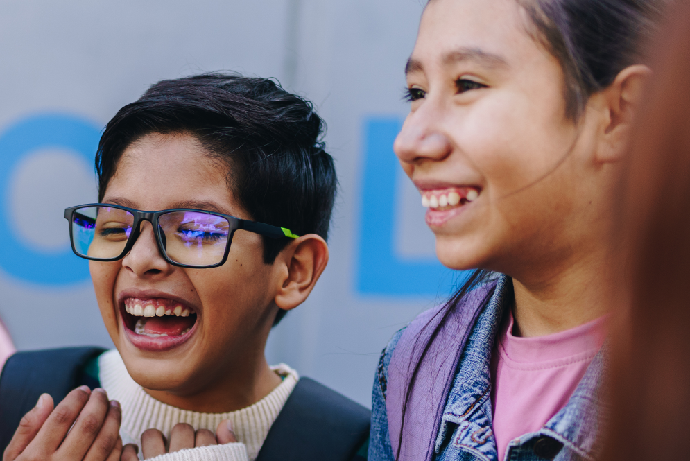 Students laughing together while learning.