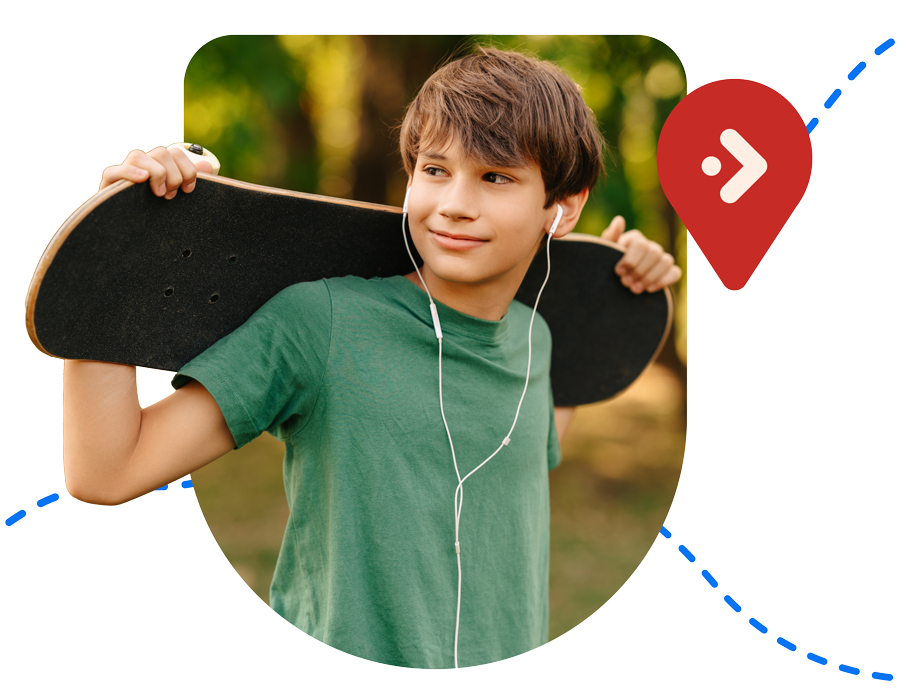 Young student holding a skateboard.